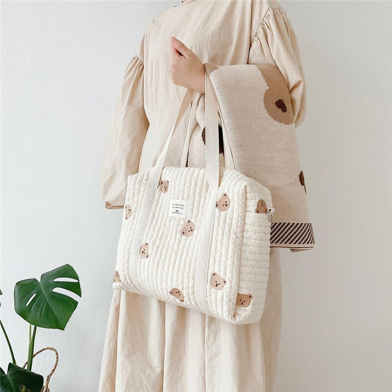 Beige quilted diaper bag